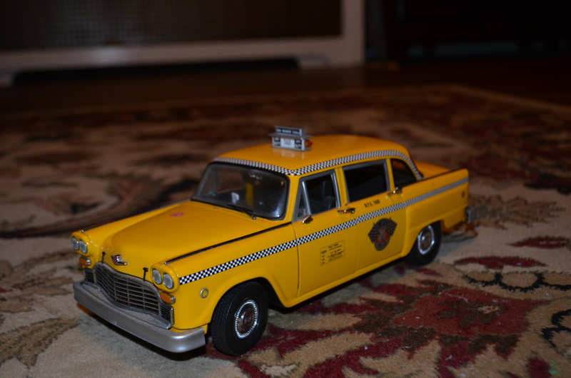 1/18 NYC Checker Marathon cab. Broken side mirror, I think some of the door handles are loose/broken.